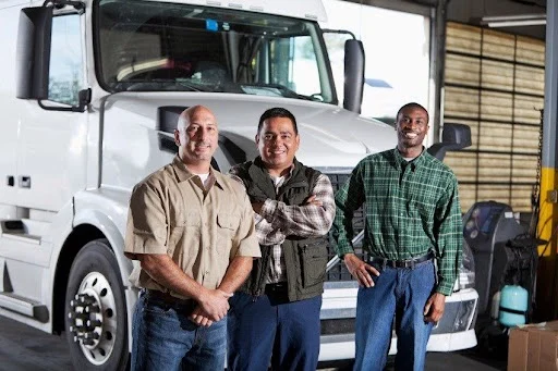 CHI Logistics drivers in front of one of our trucks